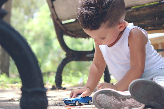 A photo of a baby playing on a baby play mat